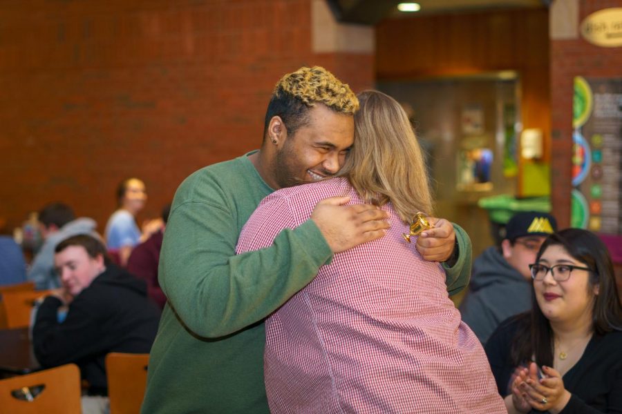 Presidential Candidates Molly Aldrich and Riaz Clark embrace as the election results are announced.