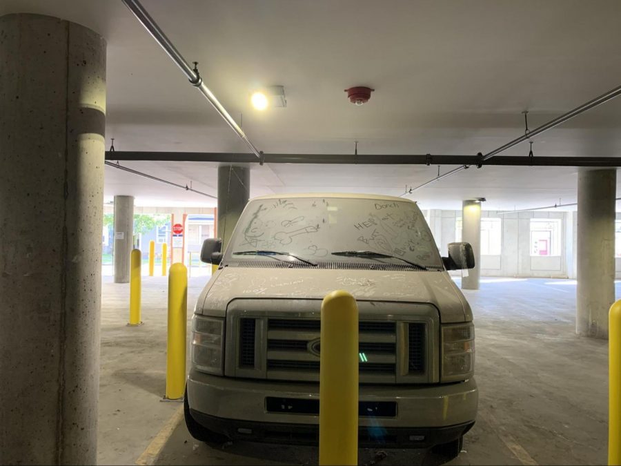 This white van hasn't moved from the Maple Street parking garage under 194 St. Paul Street since early this summer. Students have graffitied in the dust accrued on the body.