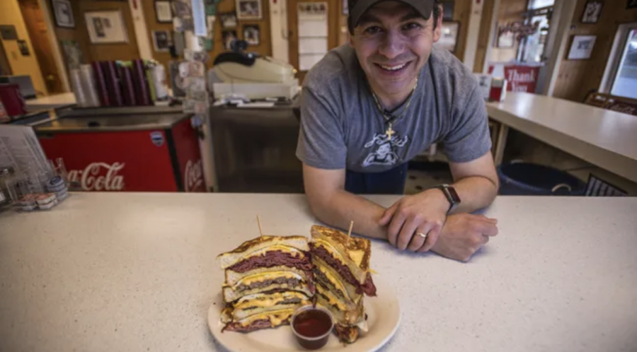Earl Handy serves up sandwiches at Handy’s Lunch, a local diner (Credit: Burlington Free Press).