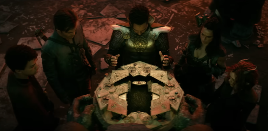 5 characters in the film Dungeons and Dragons: Honor Among Thieves gathered around a magical device.