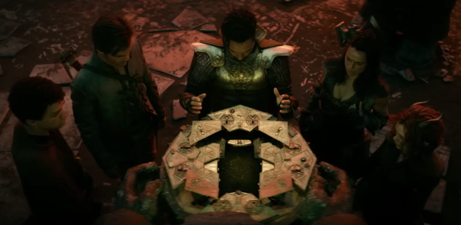 5 characters in the film "Dungeons and Dragons: Honor Among Thieves" gathered around a magical device.