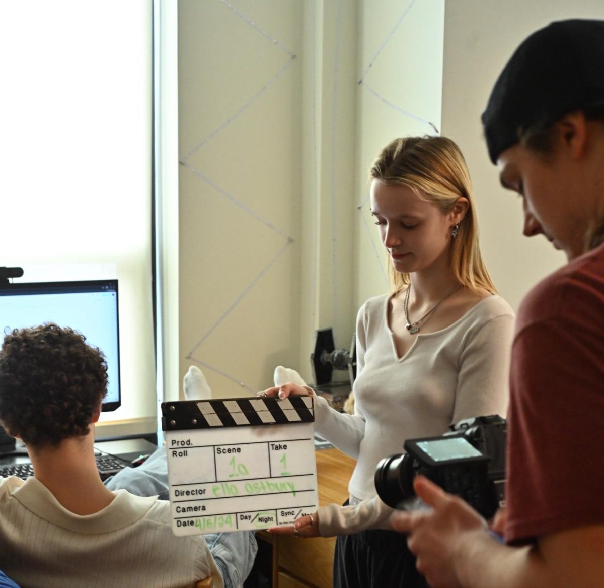 Ella lines up the slate for the first shot of the film Acidall